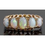 18ct gold five stone opal ring featuring five graduated oval cut cabochon opals, individually claw