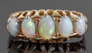 18ct gold five stone opal ring featuring five graduated oval cut cabochon opals, individually claw