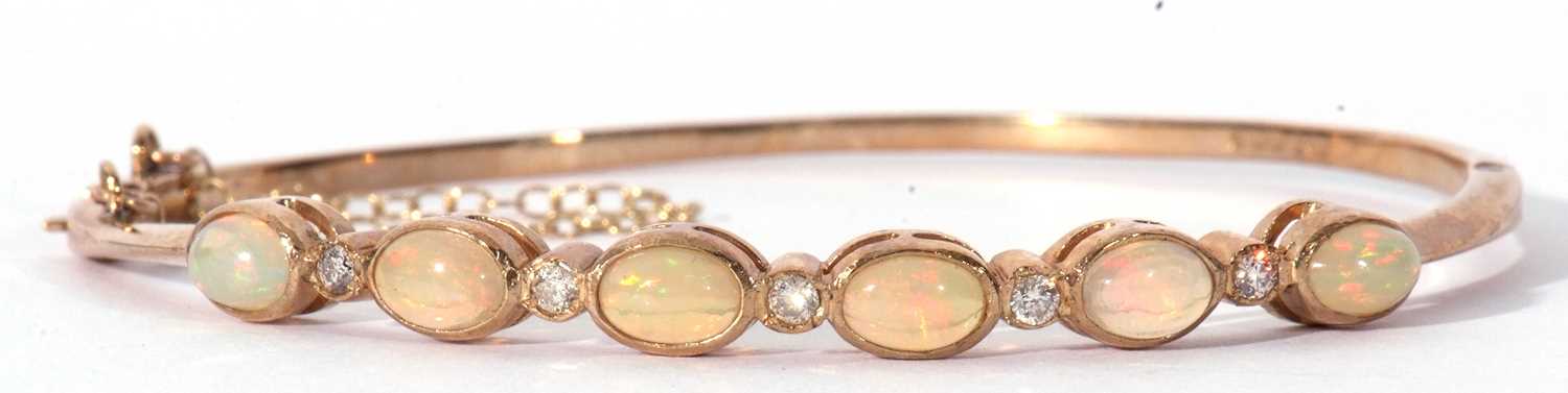 9ct gold opal and diamond set hinged bracelet, the top section with six oval cut cabochon opals, - Image 3 of 6