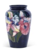 Moorcroft vase in the orchid pattern on blue ground, mid-20th century