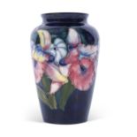 Moorcroft vase in the orchid pattern on blue ground, mid-20th century