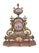 19th century gilt metal and porcelain French mantel clock, the elaborate case with large porcelain