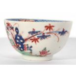 Lowestoft porcelain tea bowl and saucer, circa 1780, with a Redgrave type design of flowers and a
