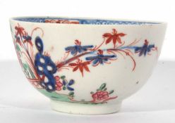 Lowestoft porcelain tea bowl and saucer, circa 1780, with a Redgrave type design of flowers and a