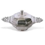 Heavy quality George V muffin dish of octagonal form with pierced side handles, having a domed lid