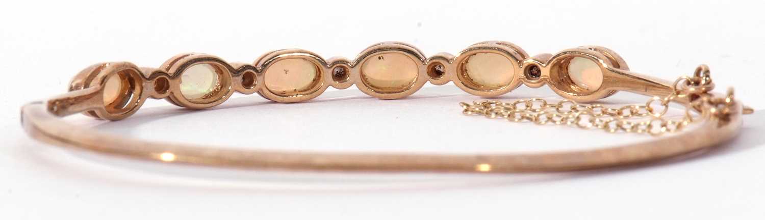 9ct gold opal and diamond set hinged bracelet, the top section with six oval cut cabochon opals, - Image 4 of 6