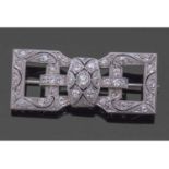 Art Deco precious metal and diamond brooch of rectangular open work shape, set throughout with