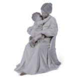 Large Royal Copenhagen model of a lady seated in a chair with small child in her lap, the base