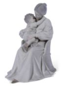 Large Royal Copenhagen model of a lady seated in a chair with small child in her lap, the base