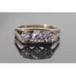 Three stone diamond ring featuring three graduated round brilliant cut diamonds, 0.50ct approx, each