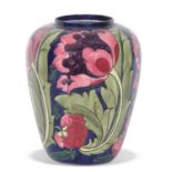 Bursley ware seed poppy style vase after a design by Charlotte Rhead, 21cm high