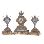 19th century French clock garniture, the clock set in an elaborate gilt metal case with urn shaped