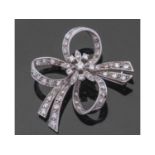 18ct white gold and diamond set floral and tied ribbon brooch, set throughout with small brilliant