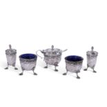 Late Victorian five piece condiment set of cylindrical form with wrythen fluted decoration and