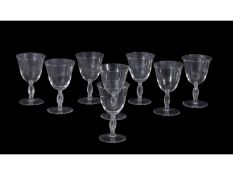 Group of eight Lalique wine glasses, the stems with a moulded thistle design, 11cm high (8)