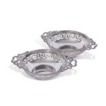 Pair of George V silver bon-bon dishes of circular form with gadrooned rim, cast ribbon tie handles,