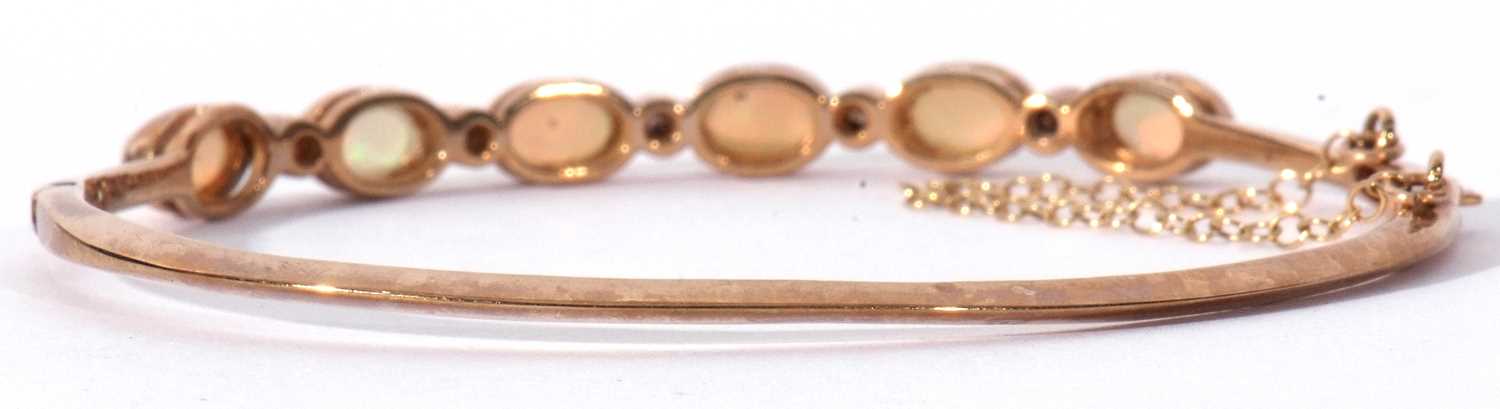 9ct gold opal and diamond set hinged bracelet, the top section with six oval cut cabochon opals, - Image 5 of 6