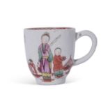 Lowestoft porcelain cup with a polychrome design of Chinese family against a fence with bird