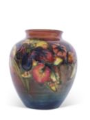 Moorcroft vase with the orchid design on flambe ground, factory stamp and signature to base