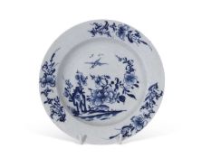 Rare early Lowestoft small plate decorated in blue and white with trailing flowers and early bird