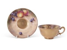 Royal Worcester cup and saucer, finely painted with fruit by Freeman, black mark to base, saucer