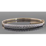 18ct gold and diamond hinged bracelet of oval form, the top section set with 19 small round
