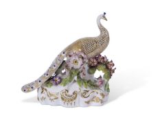 19th century Derby Stevens & Hancock model of a peacock on flower encrusted base with gilt