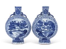 Two large Chinese porcelain moon flasks, both decorated with lake scenes and figures within