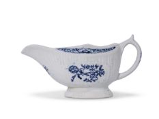 Lowestoft sauce boat, the body moulded with a fluted design, decorated in underglaze blue with