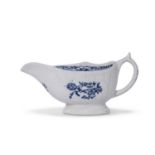 Lowestoft sauce boat, the body moulded with a fluted design, decorated in underglaze blue with