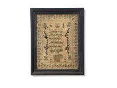 Early 19th century needlework sampler with large central panel of religious text surrounded by a