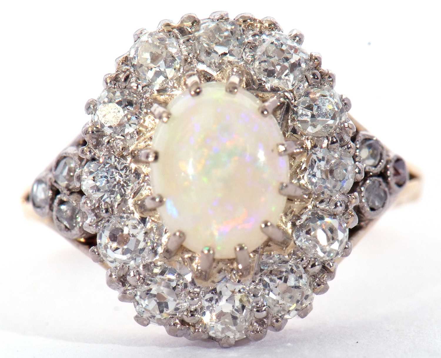 Opal and diamond cluster ring centring an oval shaped cabochon opal, multi-claw set and raised above - Image 2 of 7