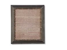 19th century needlework sampler decorated with rows of letters and numbers and religious text,