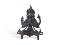 Tibetan bronze figure of a Bodhisattva in classic pose, seated on three stub feet, with metal