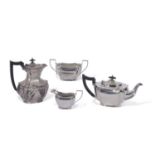 George V four piece tea service of shaped oval form with fluted corners, angular handles