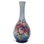 Moorcroft vase decorated with the Orchid pattern on a light green ground, Moorcroft Centenary back