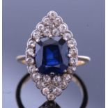 Sapphire and diamond lozenge ring, the faceted cushion shaped sapphire, 10.03 x 8.82 x 5.68
