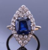Sapphire and diamond lozenge ring, the faceted cushion shaped sapphire, 10.03 x 8.82 x 5.68