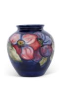 Moorcroft vase of bulbous form, mid-20th century, decorated with the anemone pattern on blue,