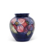 Moorcroft vase of bulbous form, mid-20th century, decorated with the anemone pattern on blue,