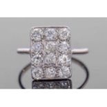 Art Deco diamond cluster ring, the rectangular panel set with 12 small round old cut brilliant