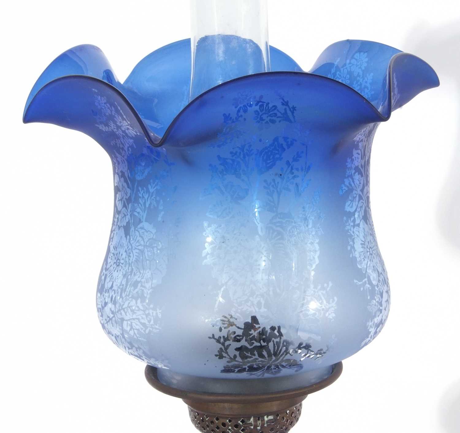 Late 19th century oil lamp, the blue glass shade with floral design above a Bohemian style blue - Image 2 of 4