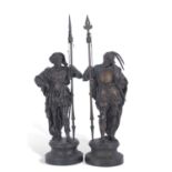 Pair of 19th century bronzed spelter models of lance wielding soldiers, raised on circular plinth
