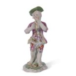 Derby model of a boy piper circa 1765, 13cm high