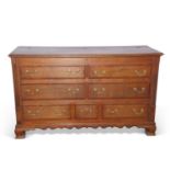 George III Lancashire mule chest, the oak and mahogany cross banded body with lift up lid, four