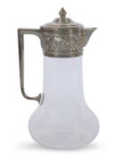 Late Victorian clear glass claret jug with star cut base, angular handle, floral and foliate