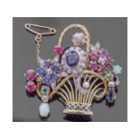 Precious gem set brooch of basket and flower design, embellished with sapphires, emeralds, rubies,