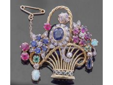 Precious gem set brooch of basket and flower design, embellished with sapphires, emeralds, rubies,
