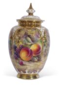 A Royal Worcester vase and reticulated cover decorated with fruit on a mossy ground, signed J