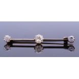 Diamond set brooch featuring three graduated old cut diamonds, each individually claw set and raised